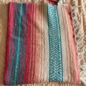 Colorful Blanket with fringe around the edges